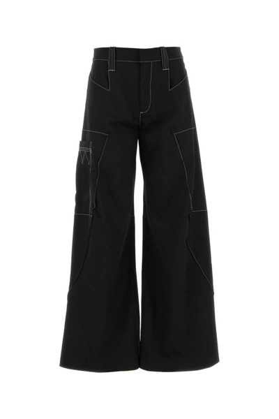 Kiko Kostadinov Angled Wide Leg Pants In Black | ModeSens