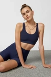THE UPSIDE PEACHED JADE SPORTS BRA IN NAVY AT URBAN OUTFITTERS