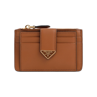 Prada Logo Plaque Zipped Wallet In Brown