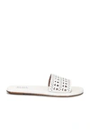Alaïa Vienne Cutout Flat Slide Sandals In Blanc Casse