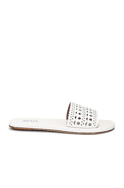 Alaïa Laser Cut Metallic Leather Flat Sandals In White