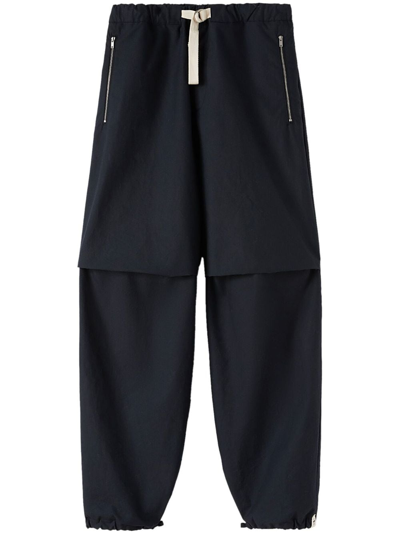 Jil Sander Panelled-design Tapered-leg Trousers In 蓝色