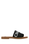 Chloé Woody Flat Logo Ribbon Slide Sandals In Black