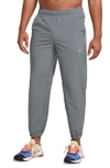 Nike Dri-fit Tapered Versatile Pants In Smoke Grey/black/reflective Silver