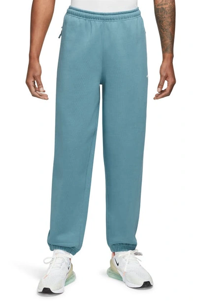 Nike Solo Swoosh Fleece Sweatpants In Noise Aqua/ White