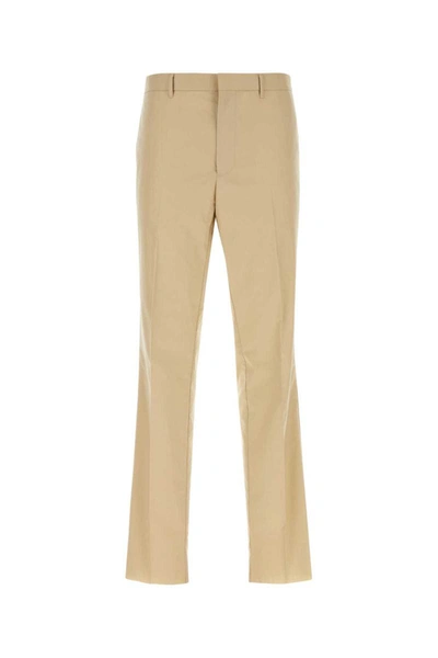 Prada Triangle-logo Tailored Cotton Trousers In Brown