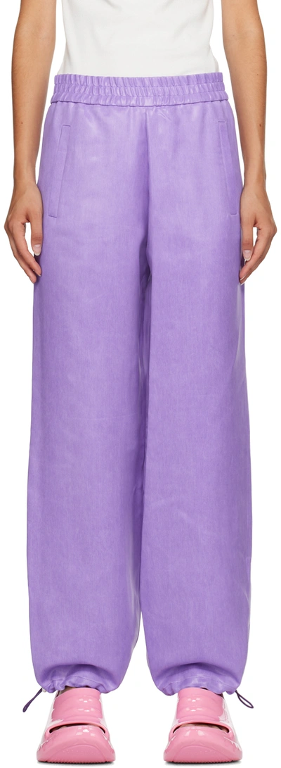 JW ANDERSON PURPLE COATED TROUSERS