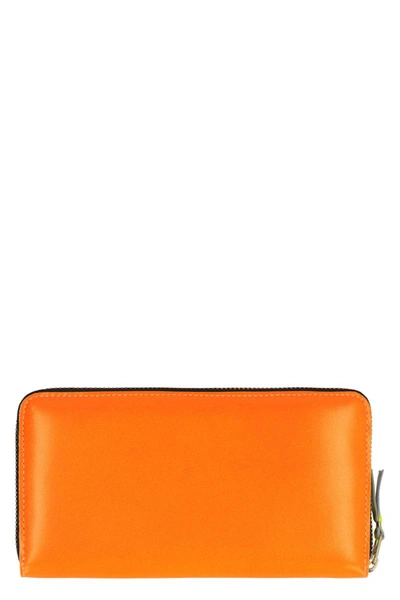 Comme Des Garçons Leather Zip Around Wallet In Orange