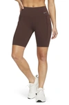 Nike Women's Universa Medium-support Mid-rise 8" Biker Shorts With Pockets In Earth/black