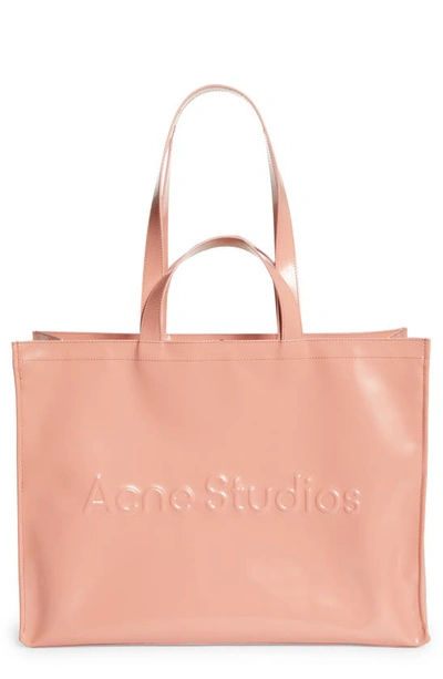 Acne Studios Logo Embossed Faux Leather East/west Tote In Salmon Pink