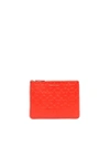 Comme Des Garçons Clover Embossed Pouch In Orange