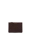 Comme Des Garçons 'embossed Clover' Leather Zip-up Pouch In Brown