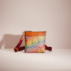 Coach Restored Kitt Messenger Crossbody In Rainbow Signature Canvas In Brass/tan Natural Multi