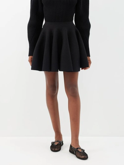 Alaïa Ribbed Flared Mid-rise Wool-blend Mini Skirt In Black
