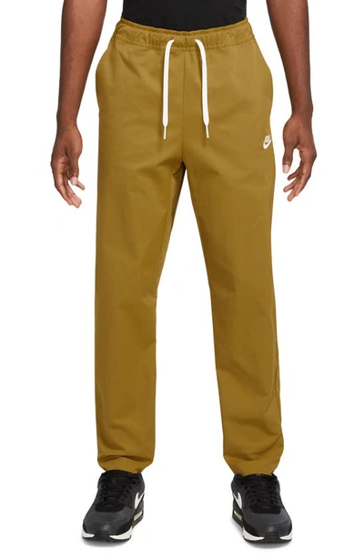 Nike Woven Tapered Leg Pants In Bronze/ White