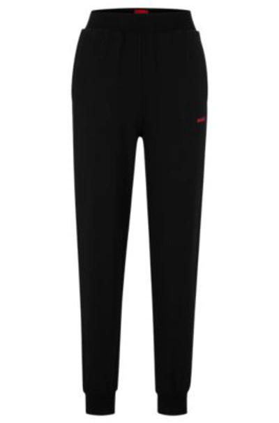 Hugo Boss Relaxed-fit Tracksuit Bottoms With Printed Logo In Black