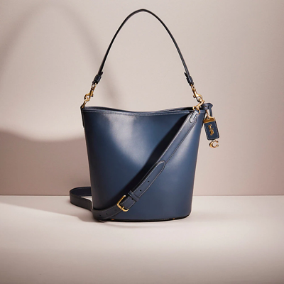 Coach Restored Dakota Bucket Bag In Brass/denim