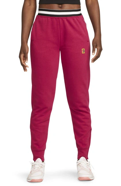 Nike Court Dri-fit Heritage Fleece Pants In Red