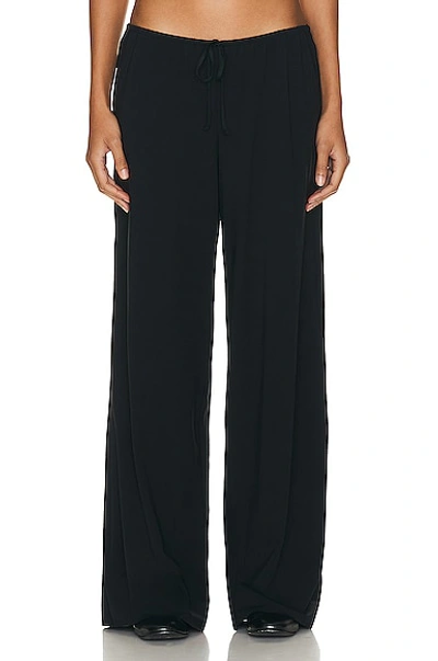 The Row Bariem Low-rise Jersey Wide-leg Trousers In Black