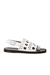 Alaïa Perforated Flat Sandal In Blanc Casse