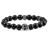 CRUCIBLE JEWELRY CRUCIBLE LOS ANGELES SINGLE SKULL STRETCH BRACELET WITH 10MM MATTE AND POLISHED BLACK ONYX BEADS