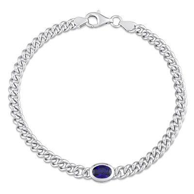 Mimi & Max 1 1/4 Ct Tgw Oval Created Blue Sapphire Curb Link Chain Bracelet In Sterling Silver