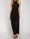 SHE + SKY LUREX HALTER JUMPSUIT IN BLACK