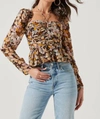 ASTR TONI RUCHED HALTER LONG SLEEVE PEPLUM TOP IN BROWN YELLOW FLORAL