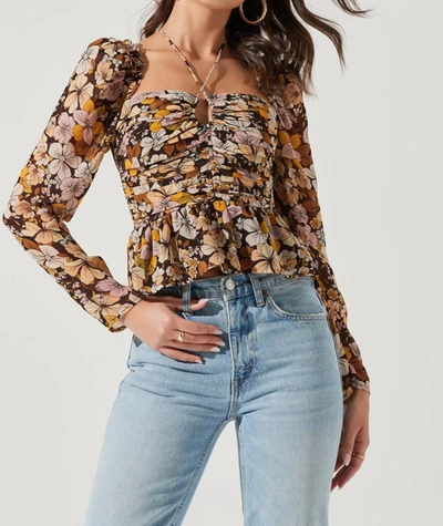 Astr Toni Ruched Halter Long Sleeve Peplum Top In Brown Yellow Floral In Multi