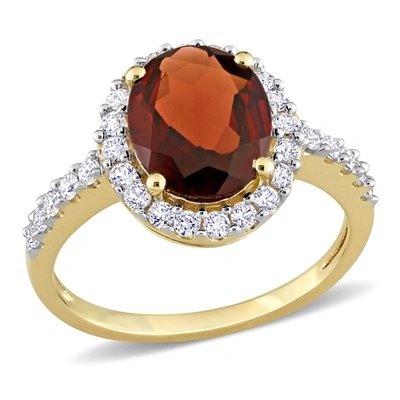 Mimi & Max 3 1/2 Ct Tgw Oval Garnet And Created White Sapphire Halo Ring In 10k Yellow Gold In Red