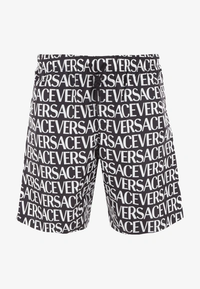 Versace All-over Logo Bermuda Shorts In Monochrome