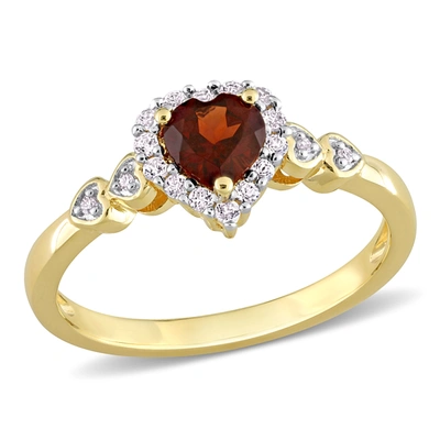 Mimi & Max 5/8 Ct Tgw Heart Shaped Garnet And Diamond Accent Halo Promise Ring In Yellow Plated Sterling Silver In Red