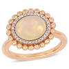 Mimi & Max 2 3/4 Ct Tgw Oval-cut Ethiopian Blue-hued Opal And 1/10 Ct Tw Diamond Halo Ring In 14k Rose Gold In Pink