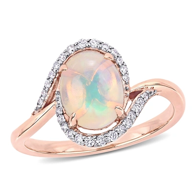 Mimi & Max 1 Ct Tgw Ethiopian Blue Opal And 1/7 Ct Tw Diamond Oval Halo Twist Ring In 10k Rose Gold In Multi