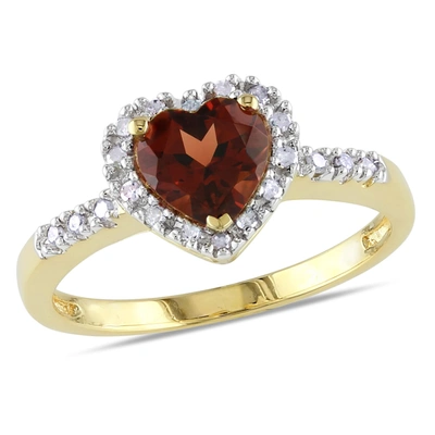 Mimi & Max Halo Heart Shaped Garnet Ring With 1/10 Ct Tw Diamonds In 10k Yellow Gold In Red