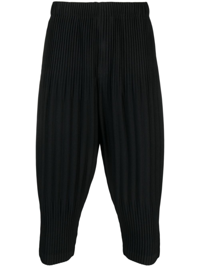 Issey Miyake Pleated Tapered Cropped Trousers In Black