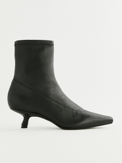 Reformation Onya Ankle Boot In Black Stretch Leather