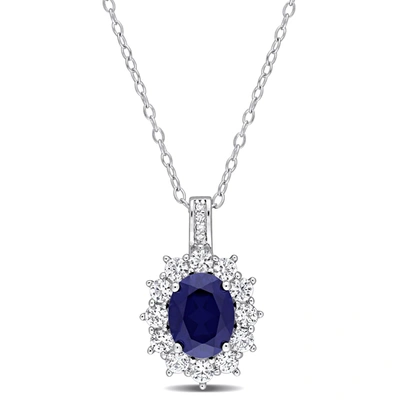 Mimi & Max 4 Ct Tgw Created Blue And Created White Sapphire And 0.02 Ct Tw Diamond Oval Halo Pendant With Chain In Silver