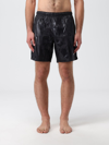 Alexander Mcqueen Solid Color Swim Shorts With Graffiti Print In Black