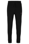 Hugo Cotton-terry Tracksuit Bottoms With Red Logo Label In Black