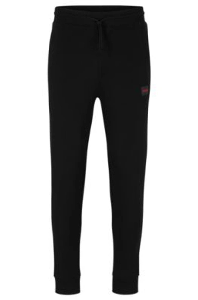 Hugo Cotton-terry Tracksuit Bottoms With Red Logo Label In Black