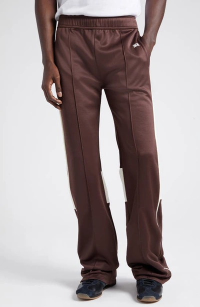 Wales Bonner Kola Embroidered Logo Track Pants In Brown