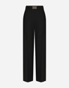 DOLCE & GABBANA FLARED WOOL PANTS WITH LOGO TAG