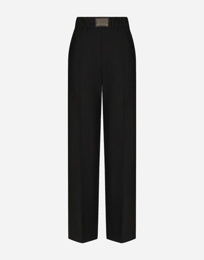 Dolce & Gabbana Flared Wool Pants With Logo Tag In Black