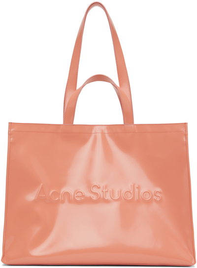 Acne Studios Logo Embossed Faux Leather East/west Tote In Salmon Pink