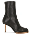 Jacquemus Black Asymmetrical Ankle Boots In Black