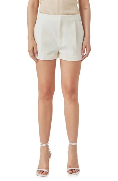 Endless Rose Pleated Low Rise Shorts In Ecru