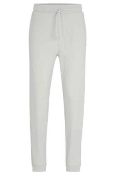 Hugo Boss Cotton-terry Tracksuit Bottoms With Logo Patch In Light Grey