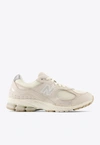 NEW BALANCE 2002R LOW-TOP SNEAKERS IN LINEN FOG WITH SEA SALT AND TIMBERWOLF