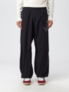 JW ANDERSON trousers JW ANDERSON MEN colour BLACK,E62403002